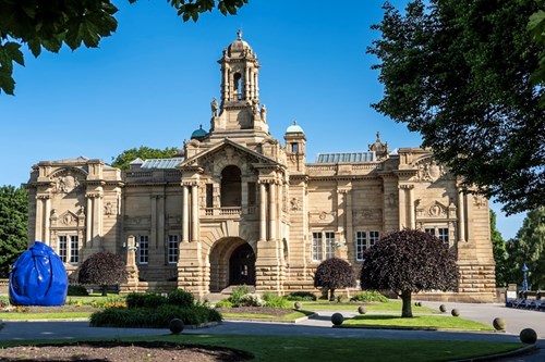 Cartwright Hall with gardens and Osman Yousefzada’s sculpture ‘ Possession I’ in the foreground.